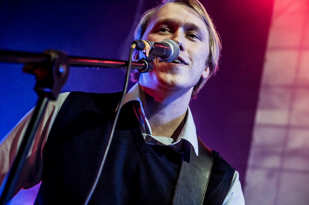 Portrait of Jan Guardian at the microphone